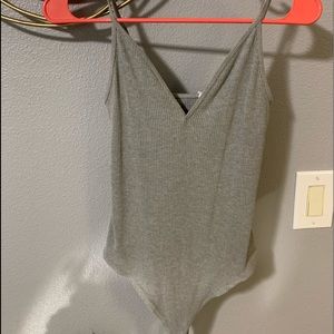 Gray body suit.